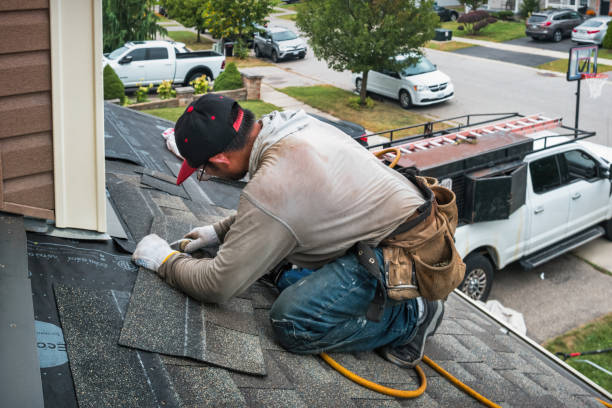 Professional Roof Replacement technician working in Abbotsford, WI